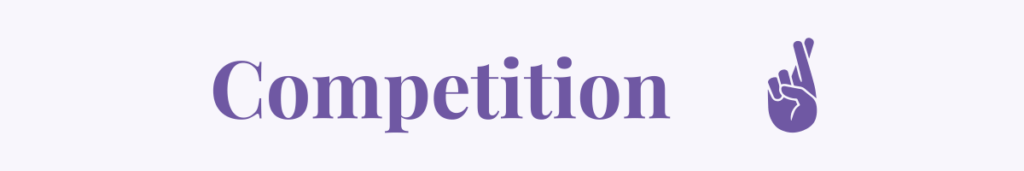 Competition banner with crossed-fingers icon.